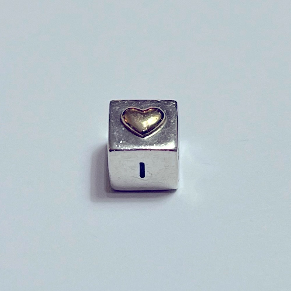 Retired Pandora Sterling Silver/14k gold “I Love You” block charm.